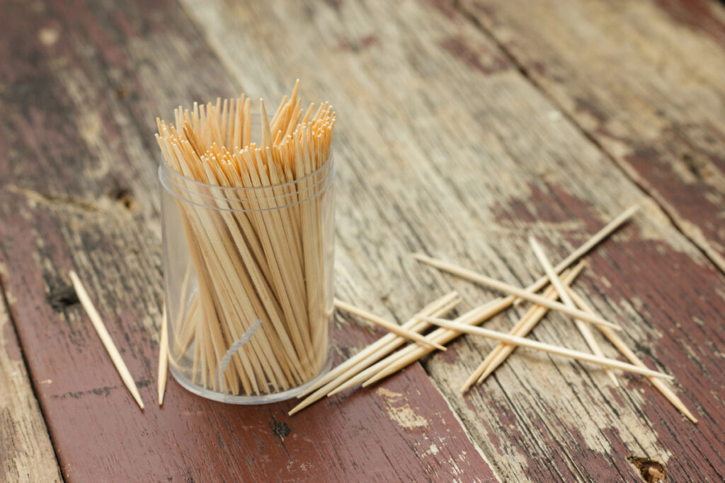 Wooden Toothpicks on wood background