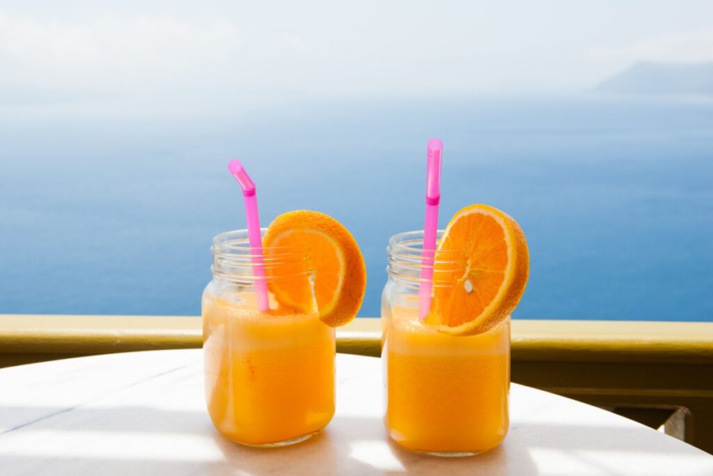 Two glasses of fresh orange juice on the table