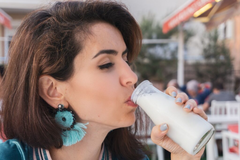 Woman drinking fresh ayran buttermilk