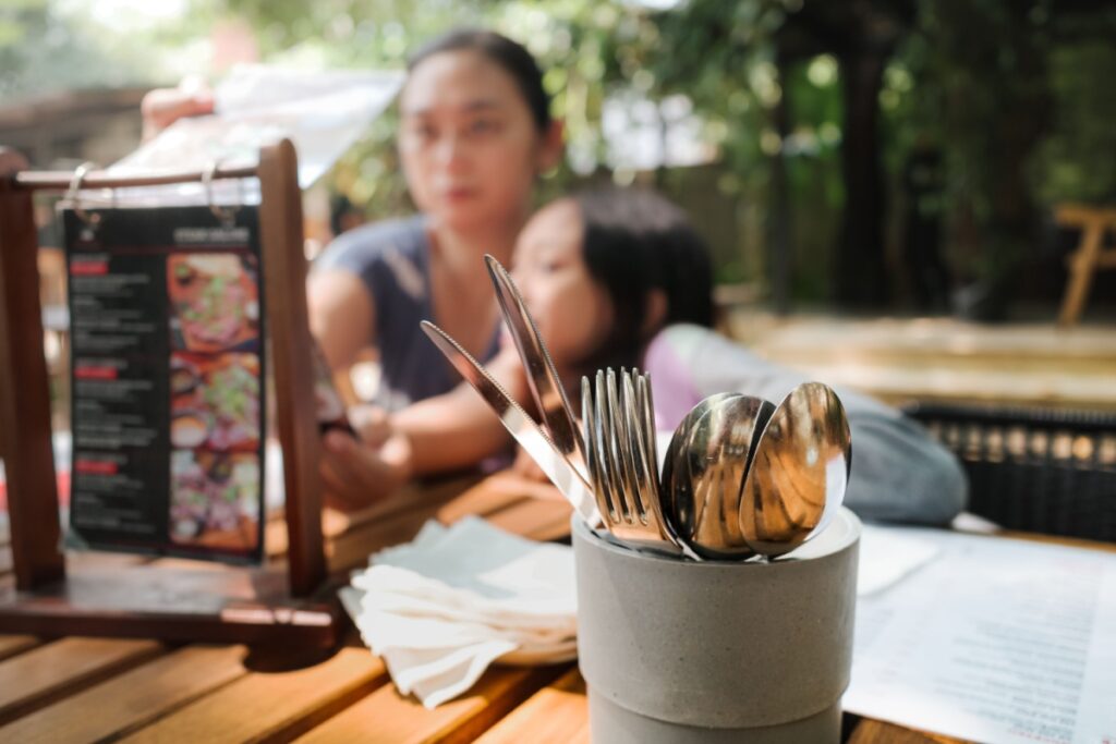 cutlery silverware at restaurant mom daughter looking at menu