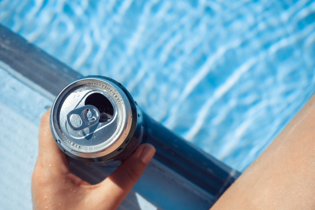 drinking soda beer by pool