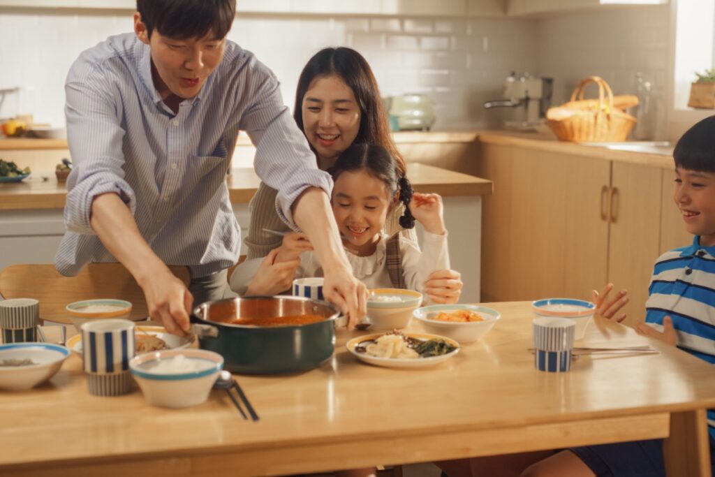 happy Korean family at dinner table