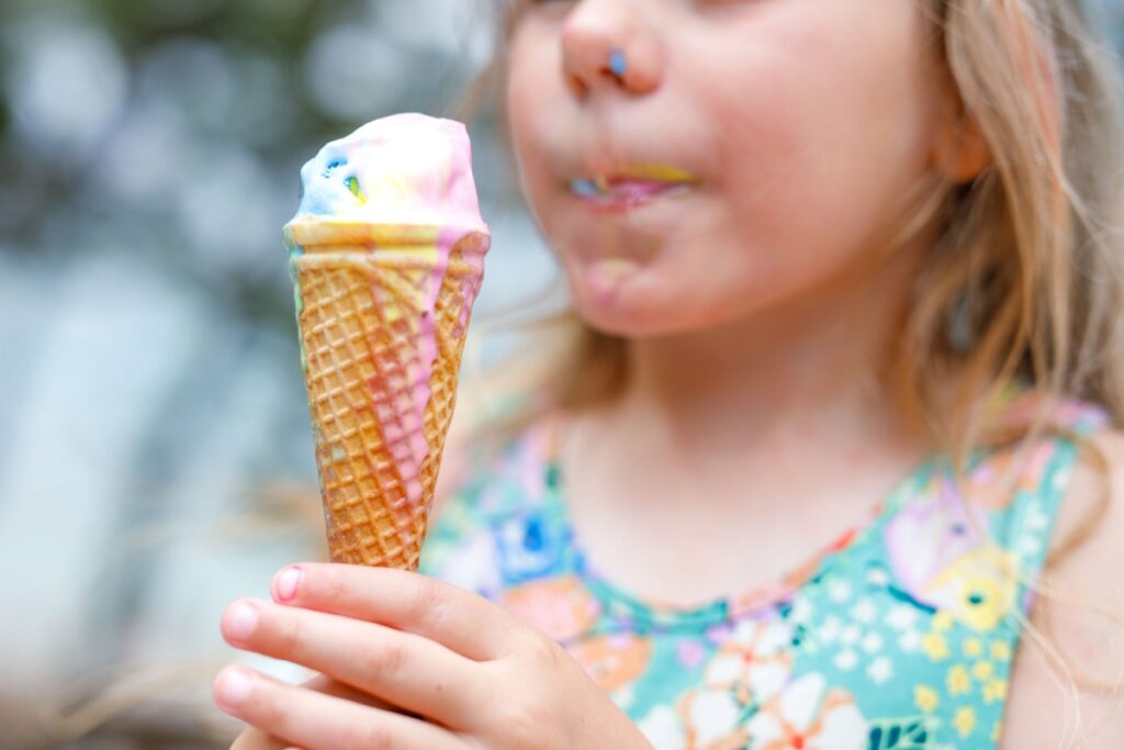 little kid eating ice cream cone