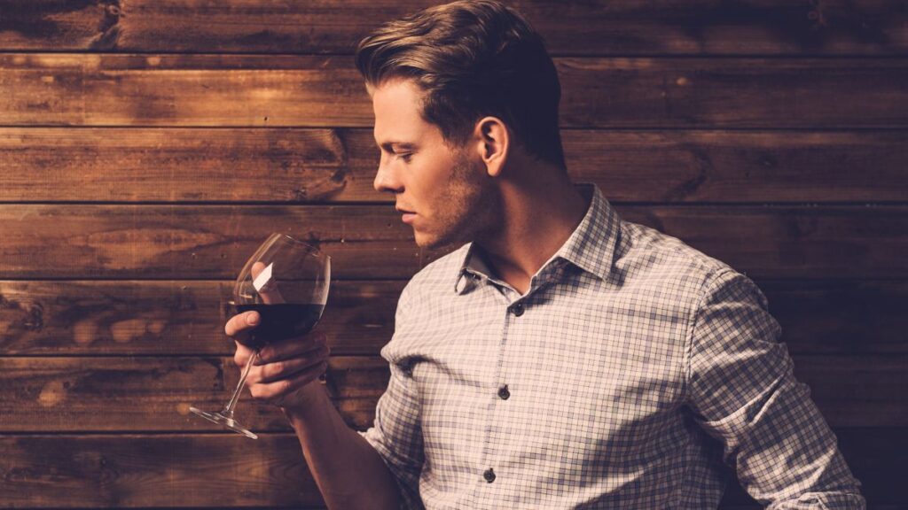 man with glass of wine