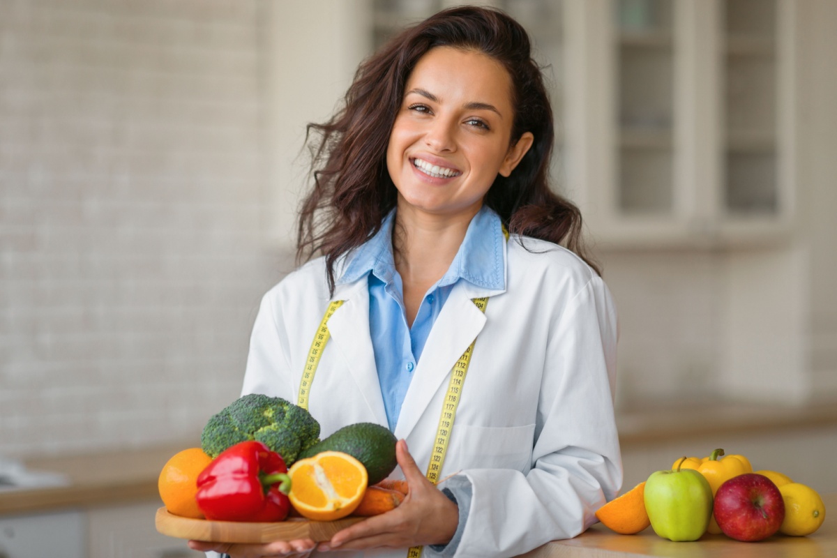 nutritionist woman holding fruits and vegetables weight loss