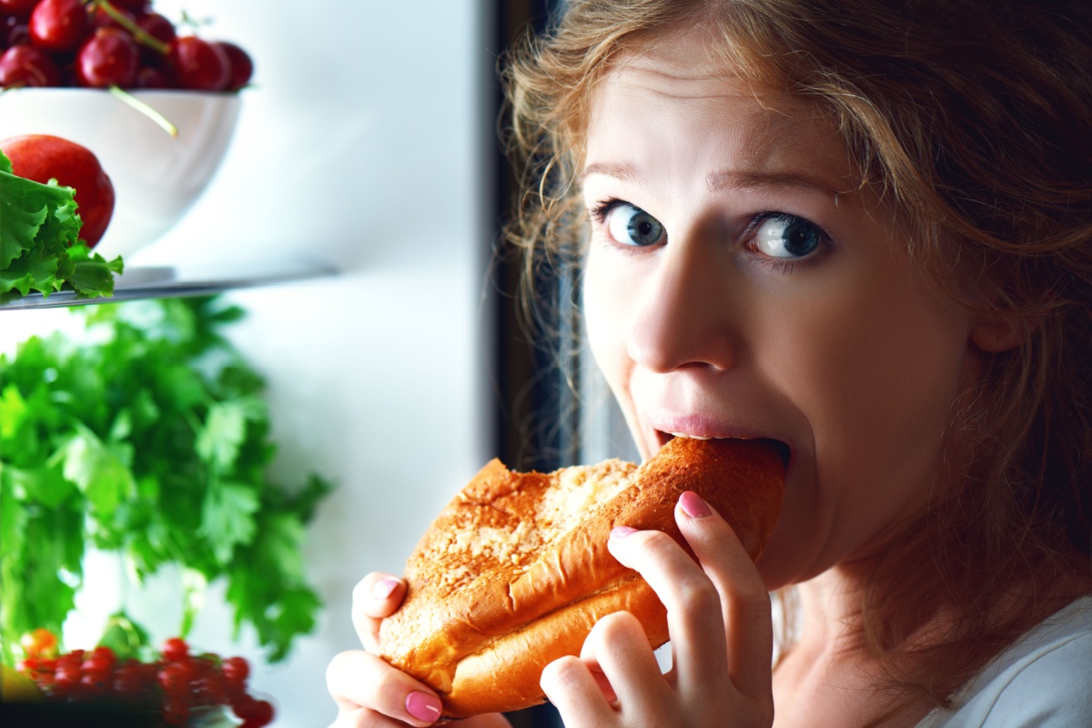 woman breaking diet eating sweets