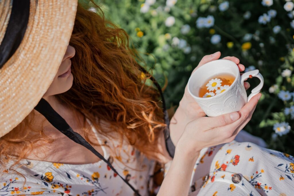 woman drinking Herbal chamomile tea