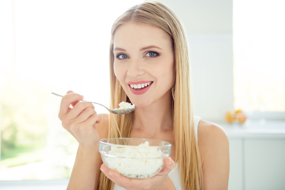 woman eating cottage cheese probiotics