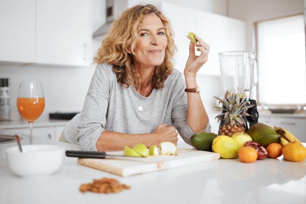 woman in kitchen fruit wine