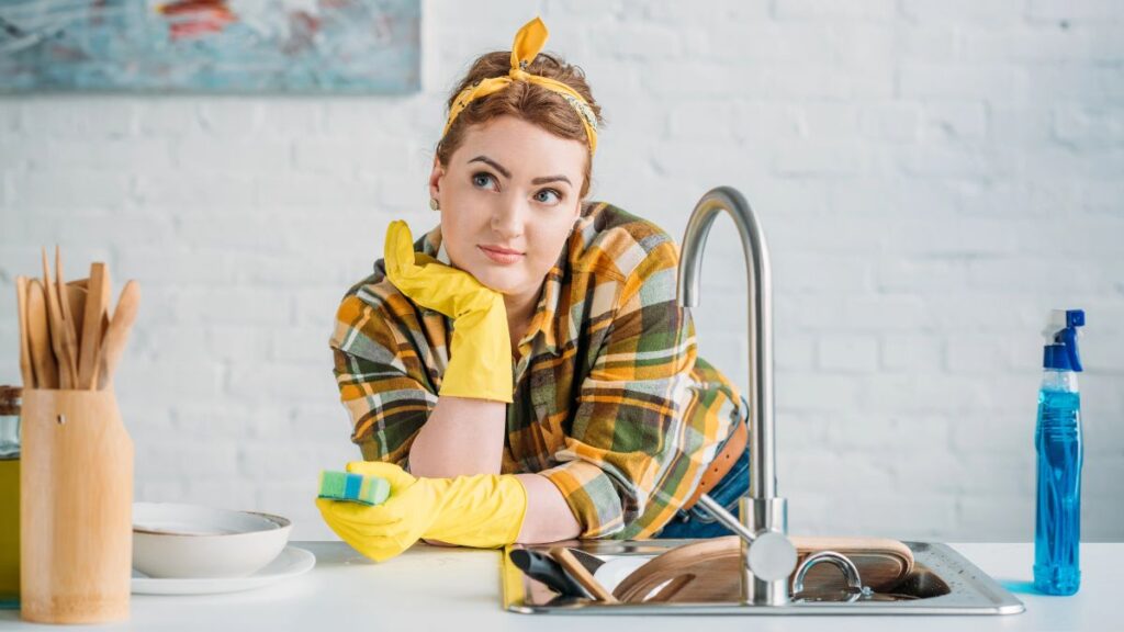 woman leaning on sink