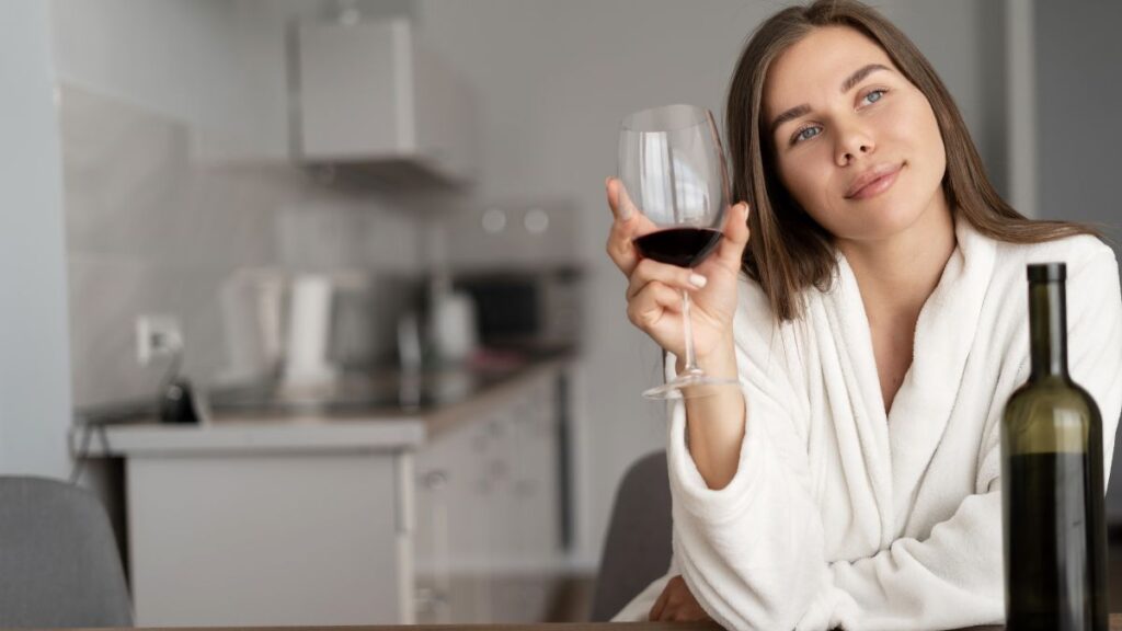 woman thinking with wine