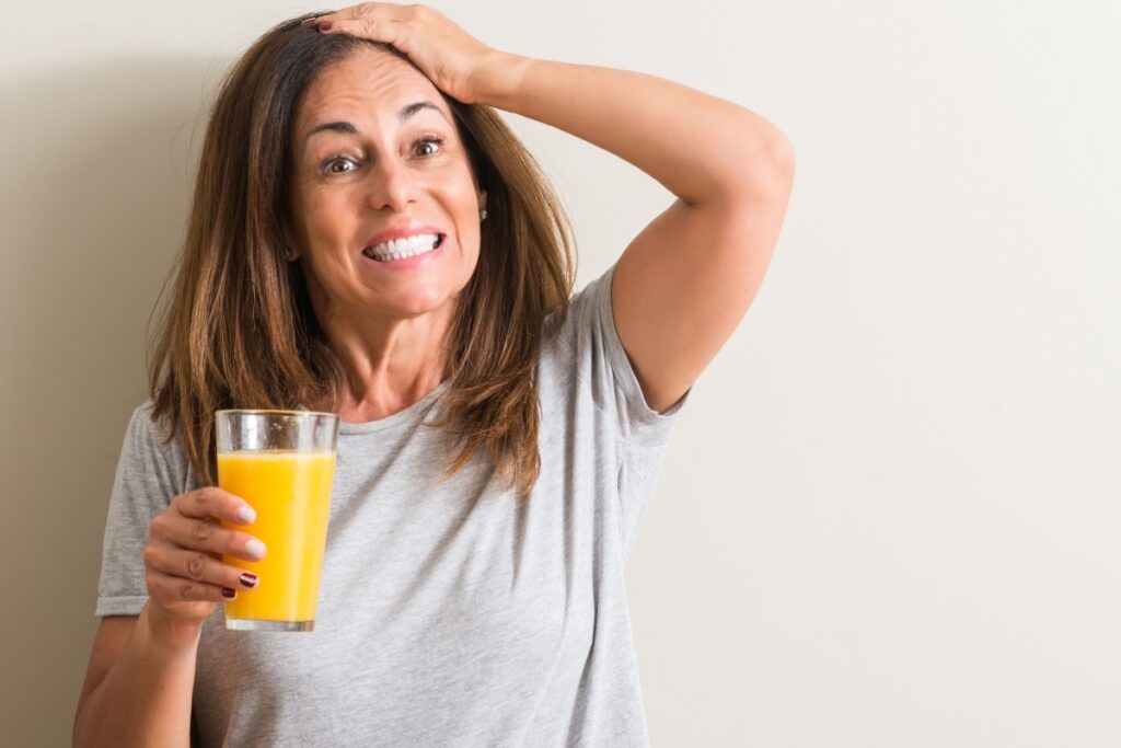 woman with orange juice acid reflux