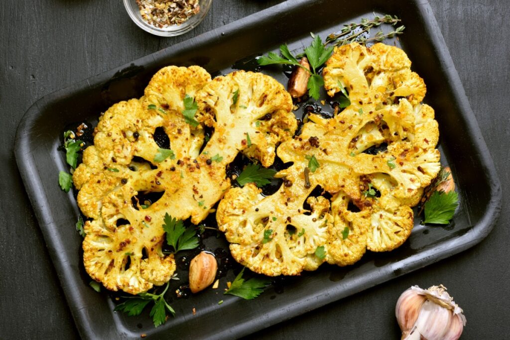 Baked cauliflower steaks with herbs and spices 