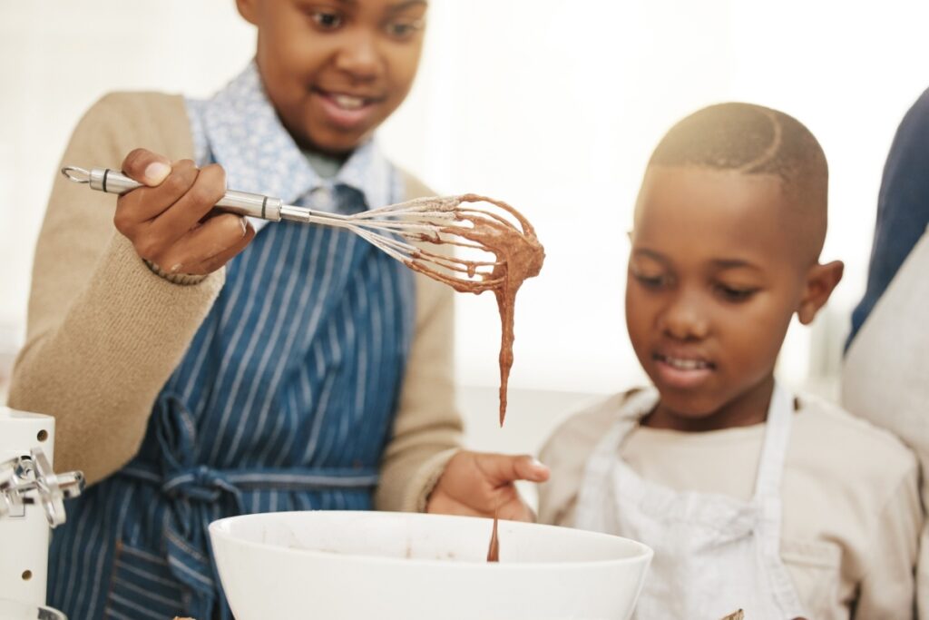 kids baking whisking chocolate