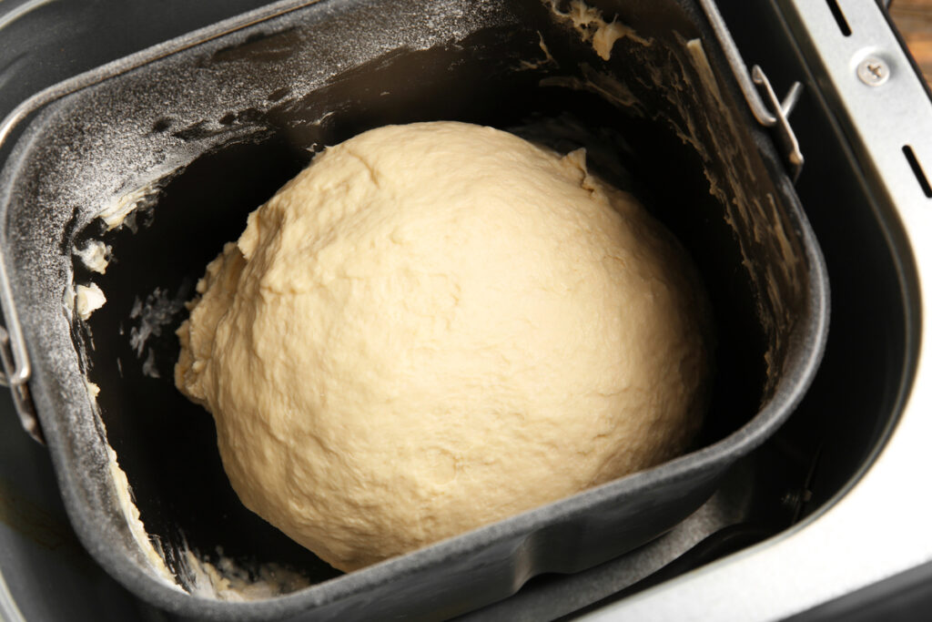 Raw dough in bread machine, closeup