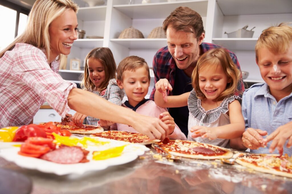 Family making pizza for dinner