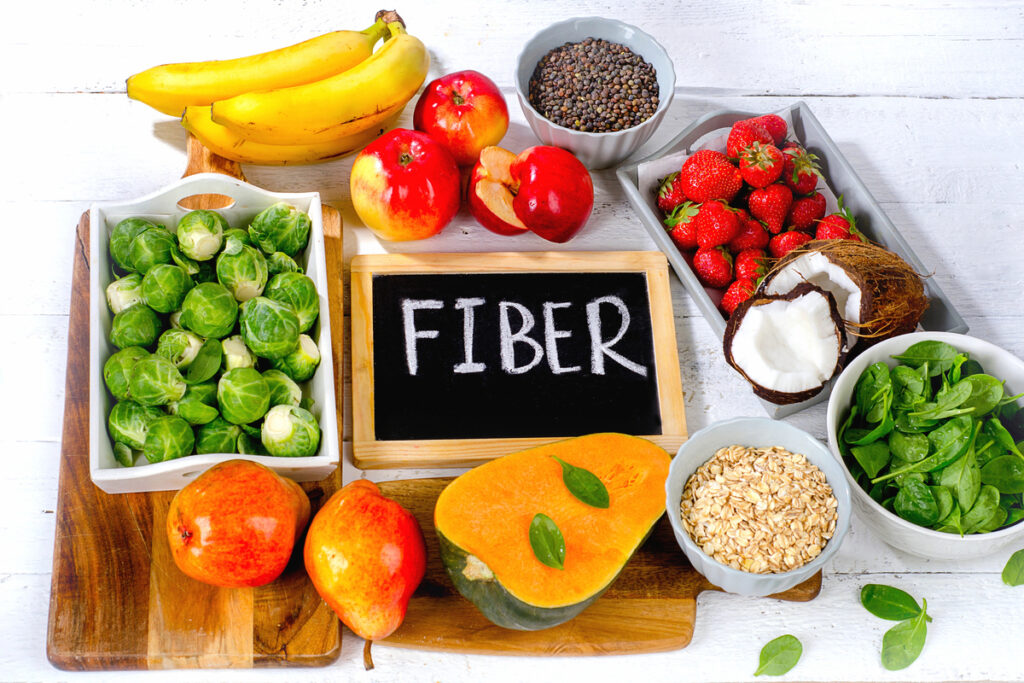 High Fiber Foods on a white wooden background. View from above