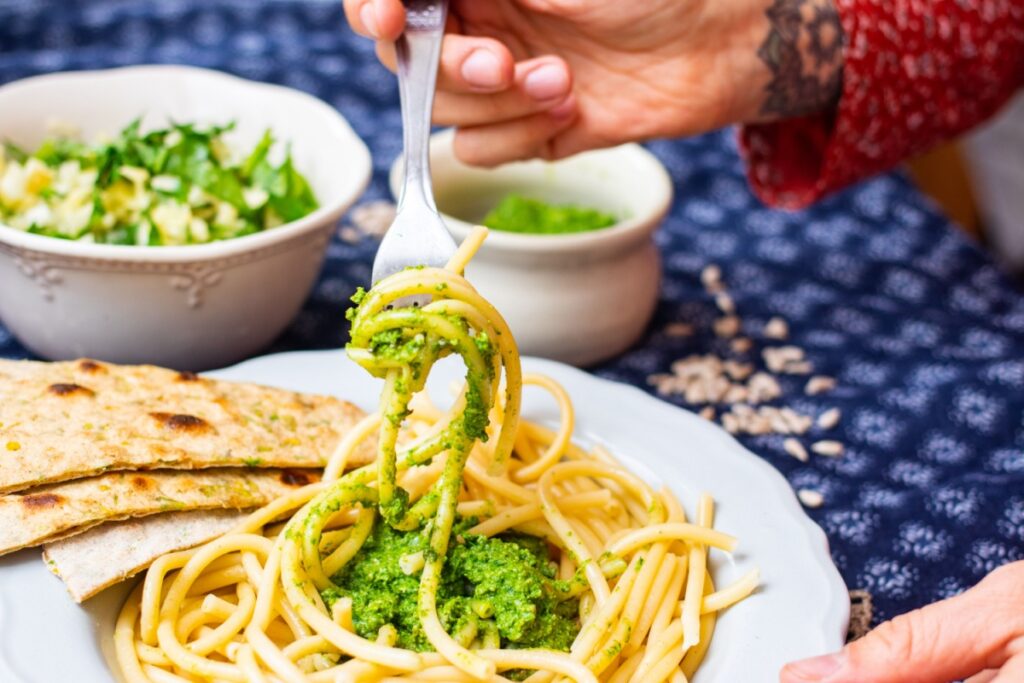 eating pesto pasta on date