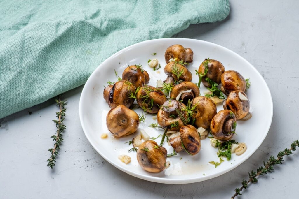 Garlic fried champignons mushrooms 