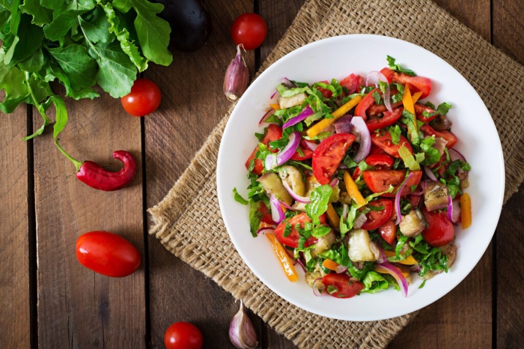 Salad baked eggplant and fresh tomatoes