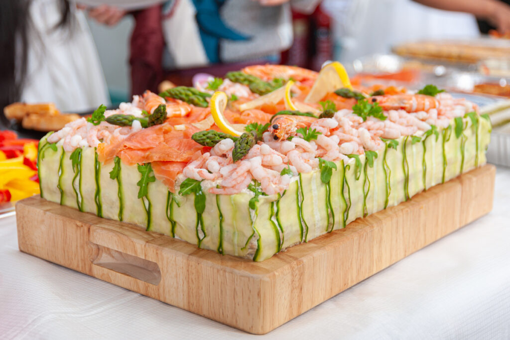 Smörgåstårta, Swedish sandwich like cake or sandwich torte is a dish with seafood ingredients like salmon, shrimps and prawns.