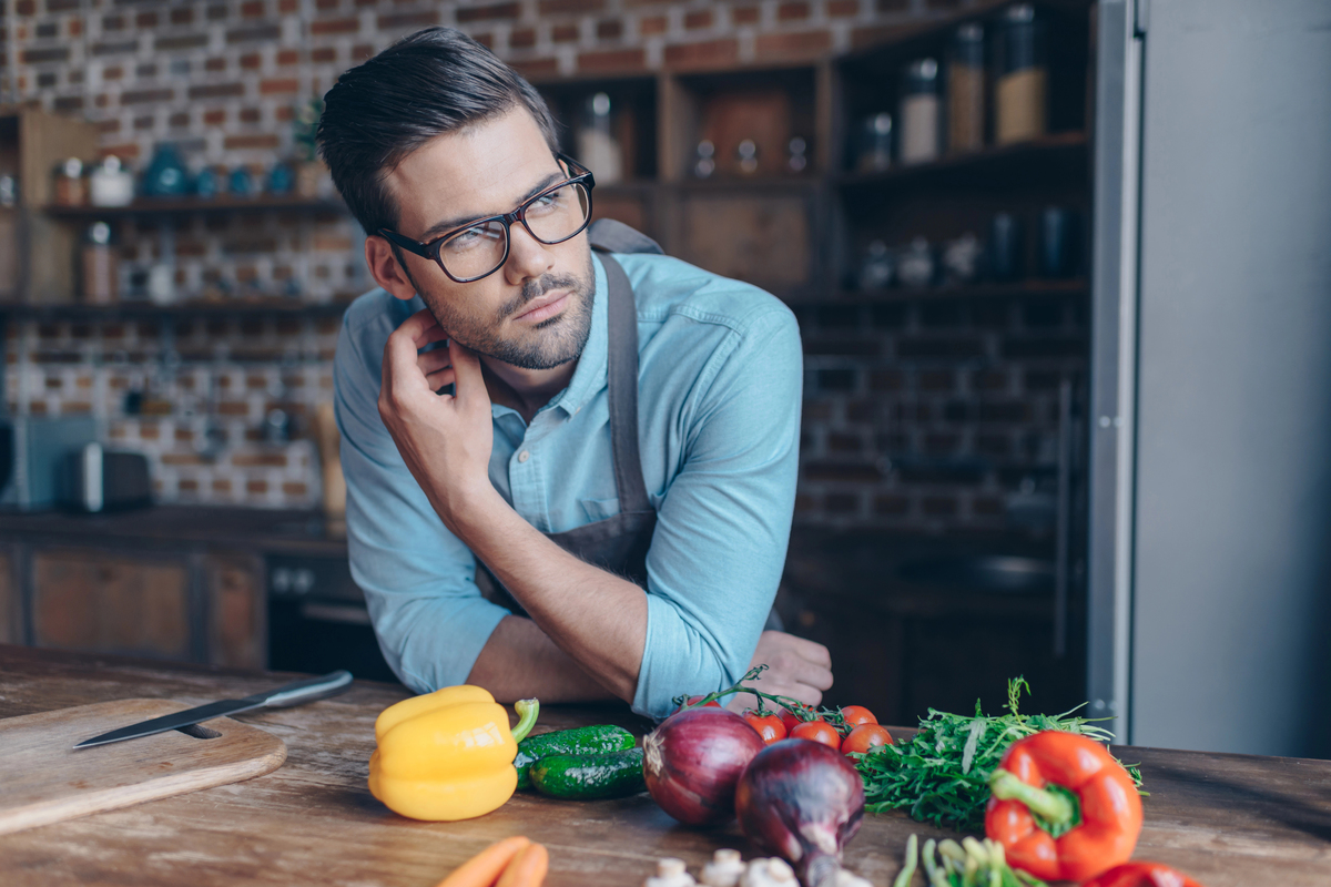 Thoughtful young man at kitchen