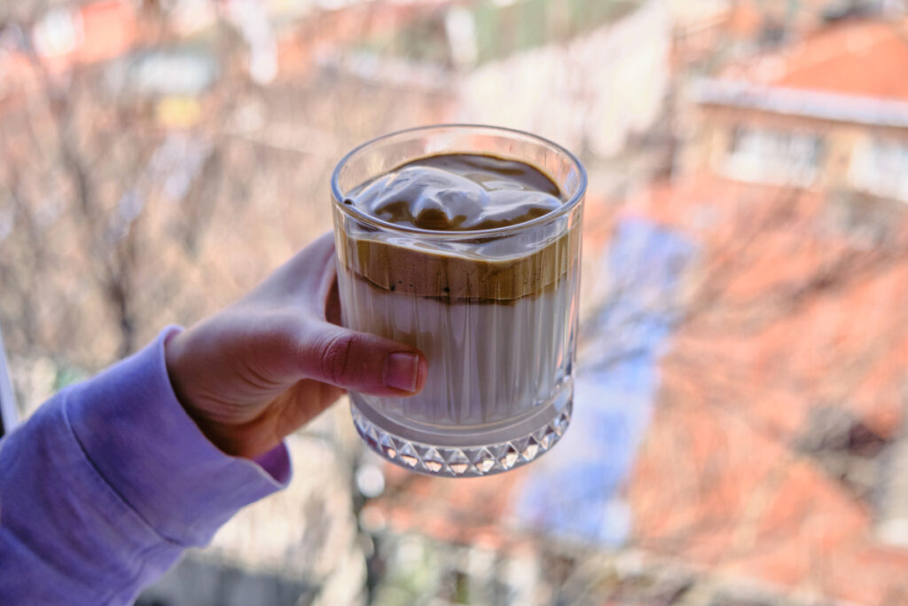 Iced Dalgona Coffee, Whipped Trendy Korean Coffee with Coconut Sugar and Soya Milk. Vegan Dalgona Coffee.