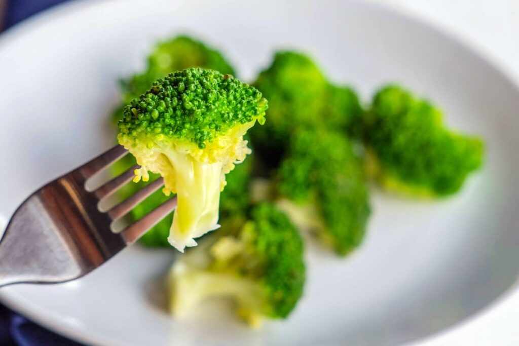 cooked broccoli on fork