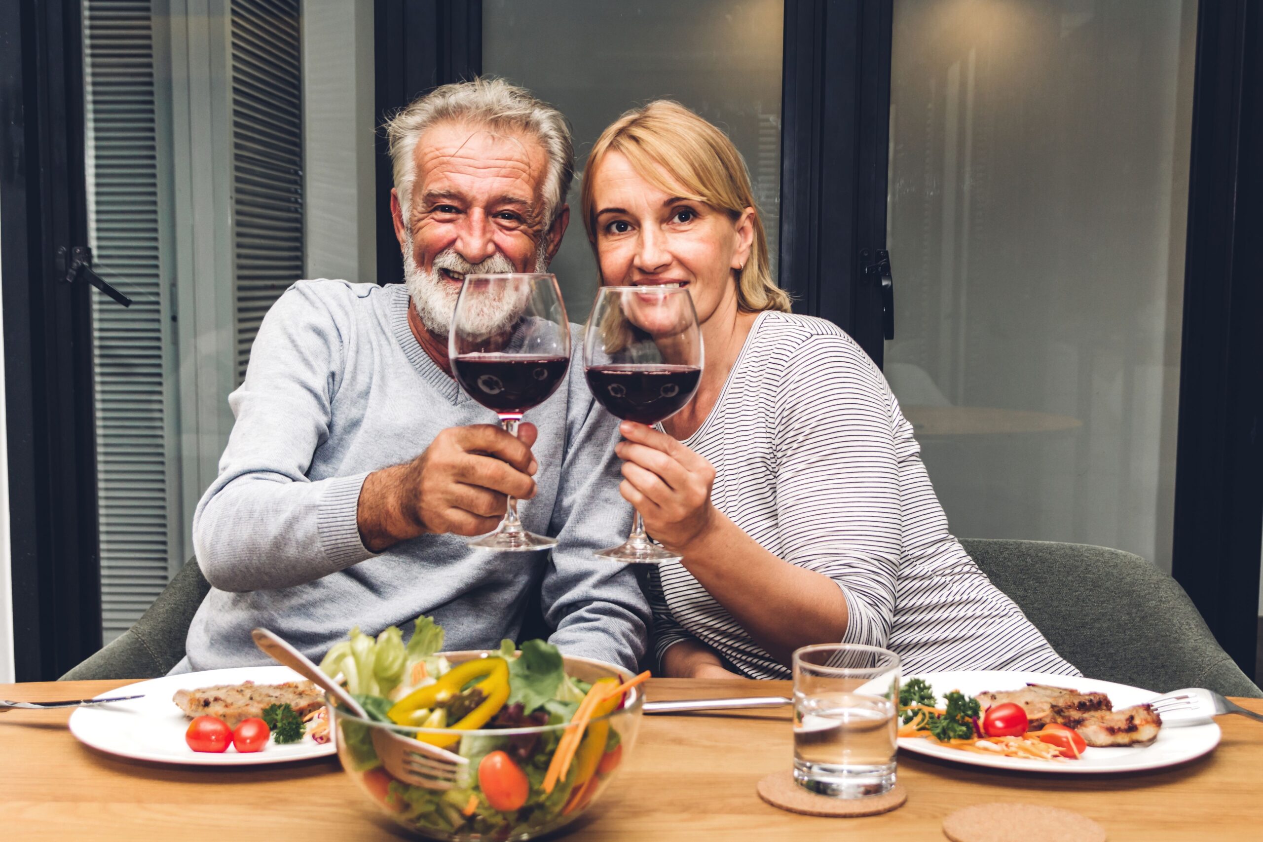 couple having date night at home dinner and wine