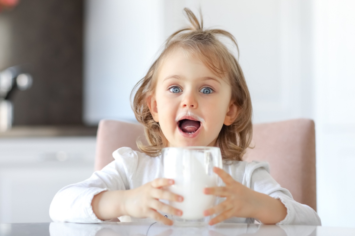 happy little kid drinking milk