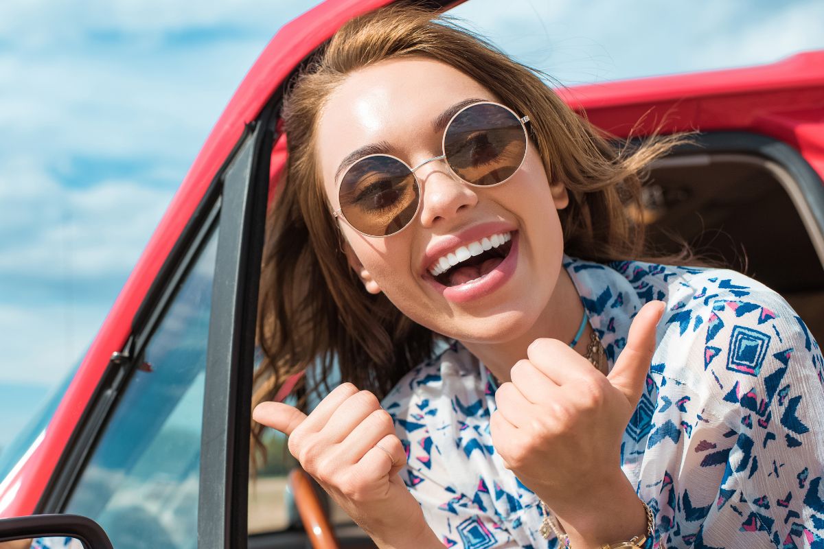 happy woman in a car