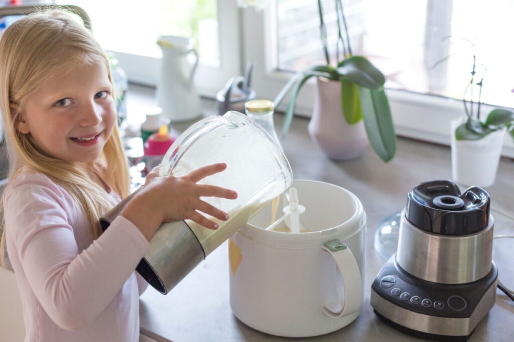 kid making homemade making ice cream