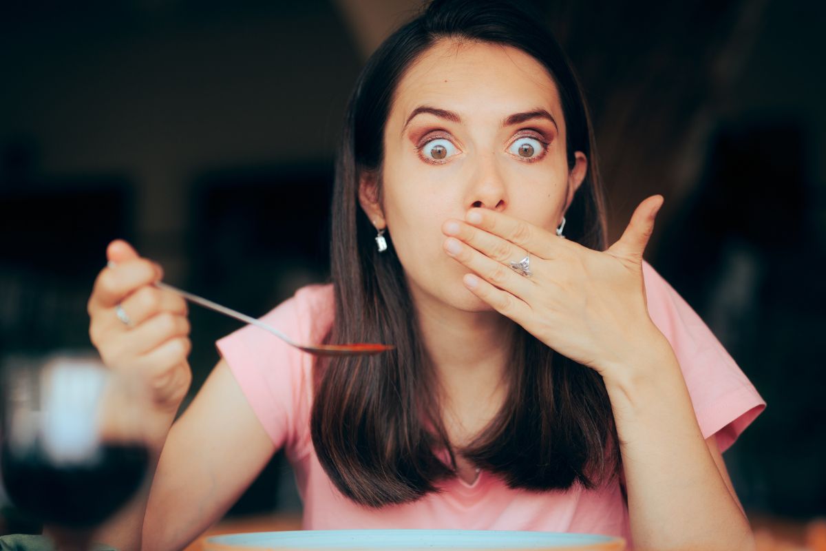 Woman eating spicy food