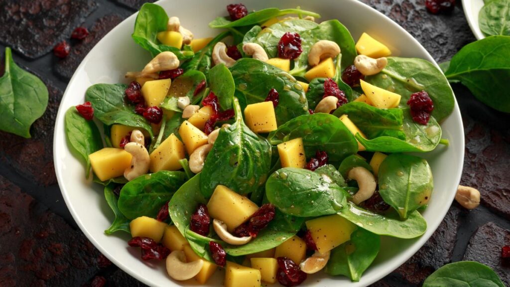 mango Dried Cranberries cashews spinach salad