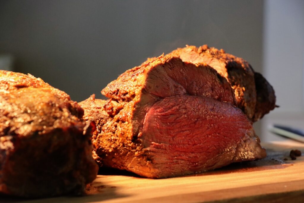 roast beef meat at the buffet under golden lights