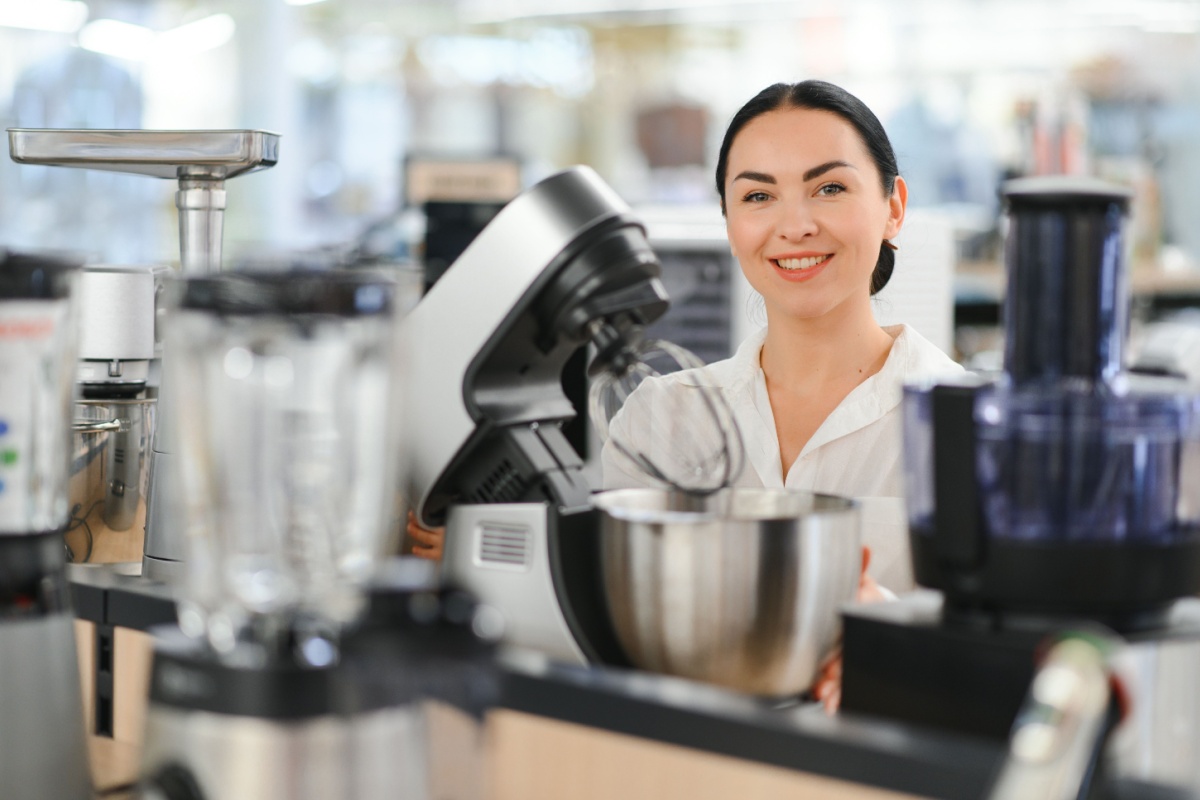 woman choosing kitchen mixer