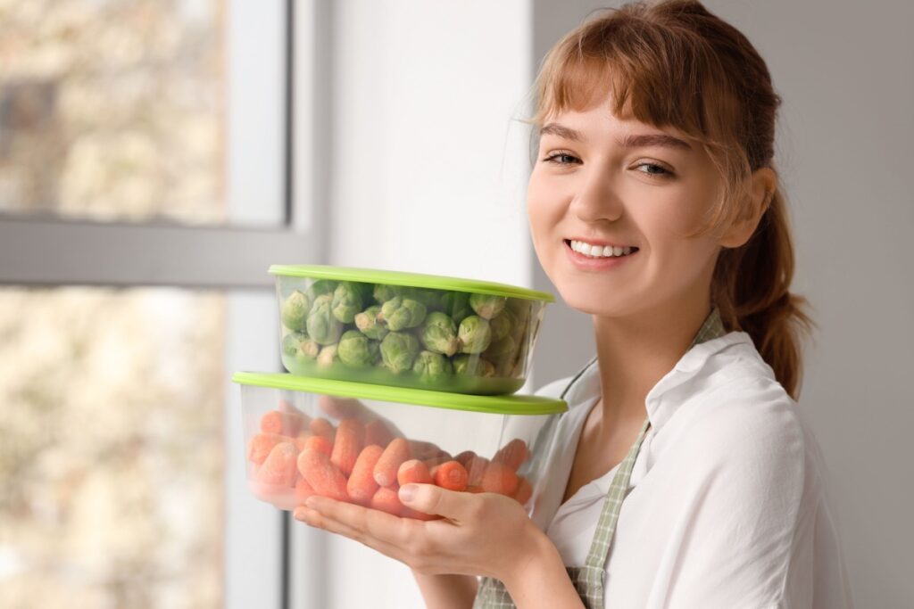 woman holding Tupperware