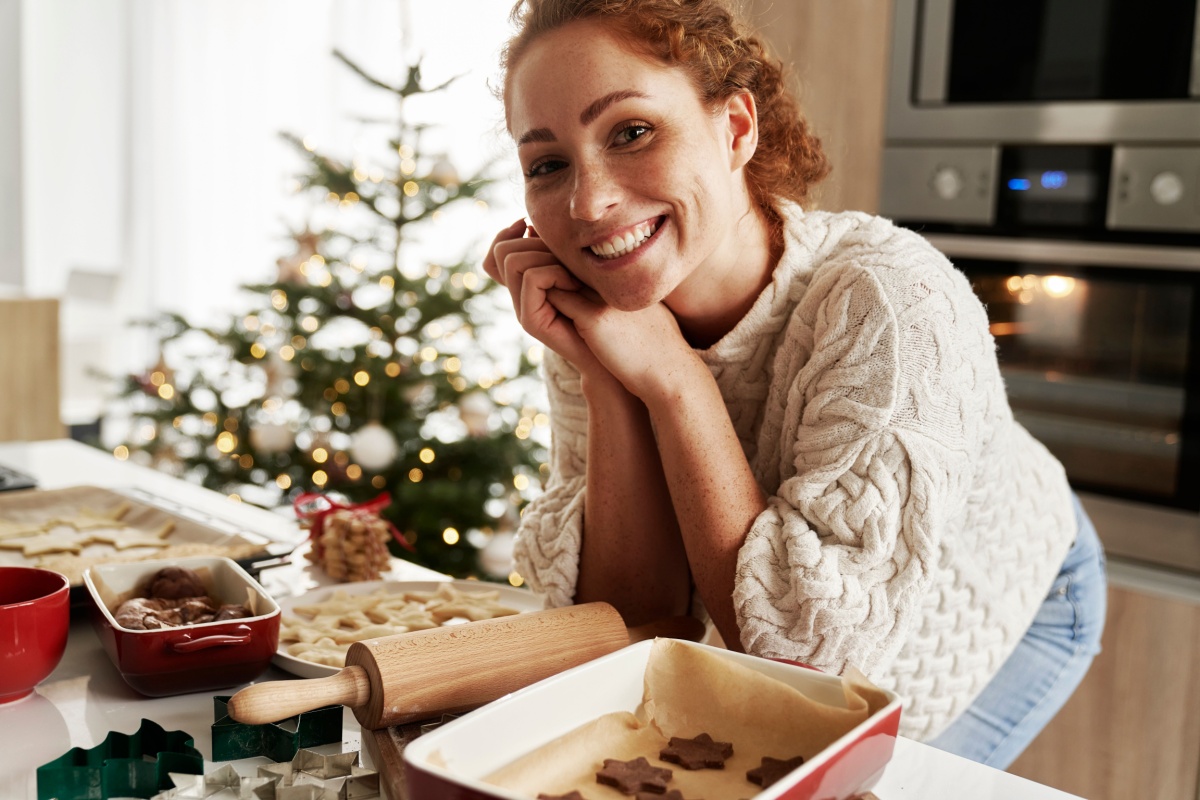 woman preparing gingerbread cookies for Christmas