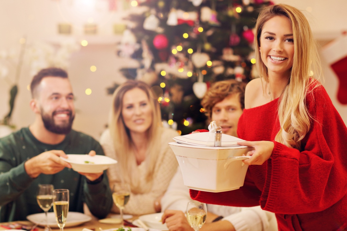 woman serving Christmas dinner holidays