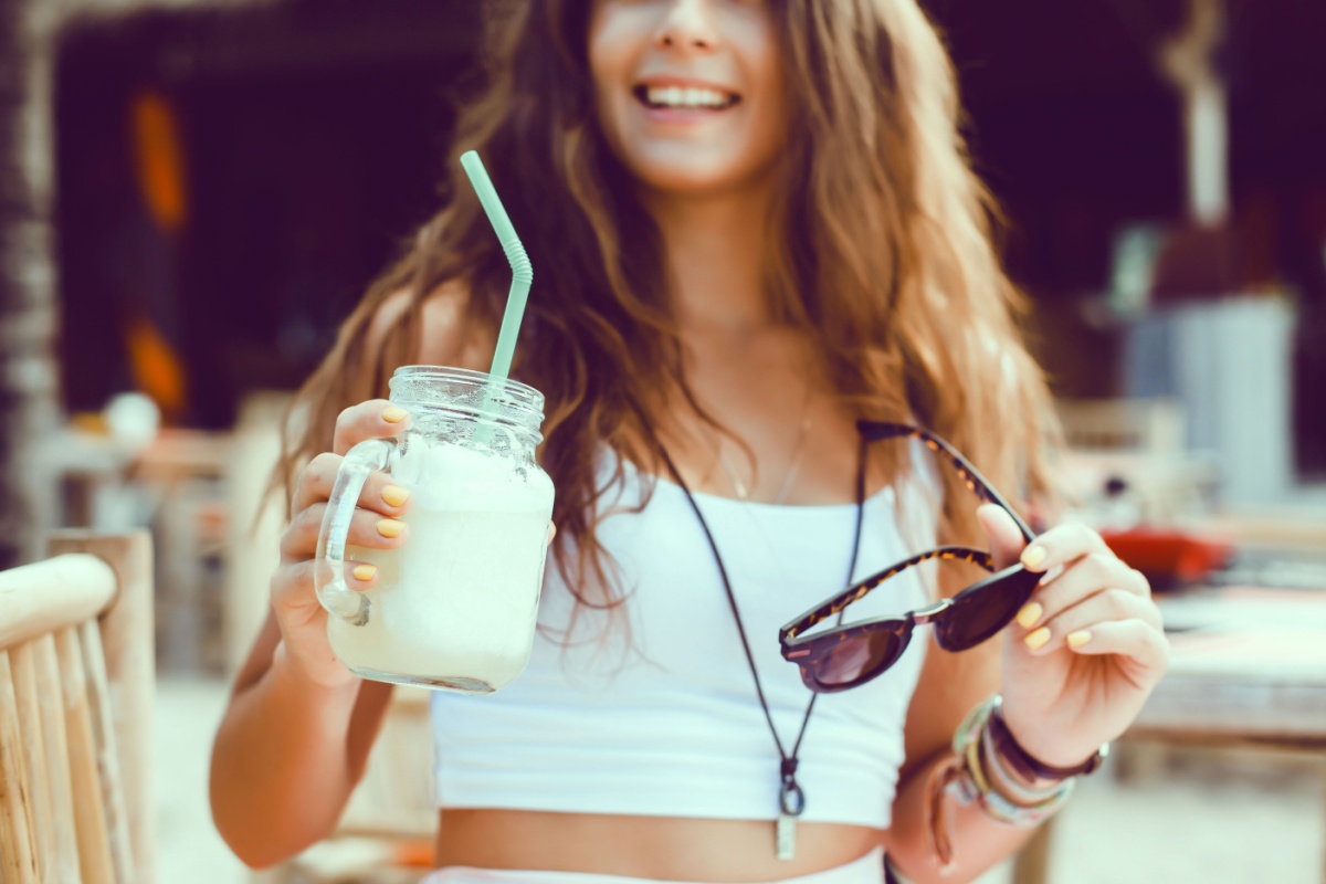 woman with smoothie and sunglasses