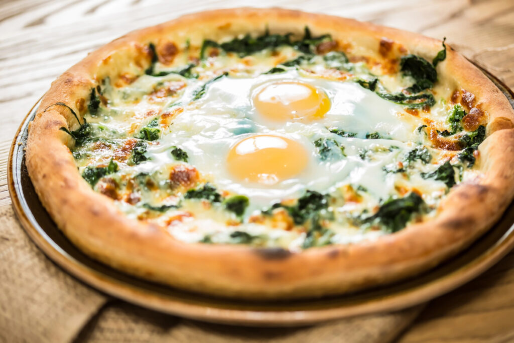 Margarita pizza with arugula and egg